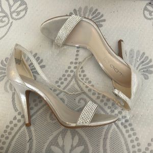Silver heel. Rhinestone. Also heel.